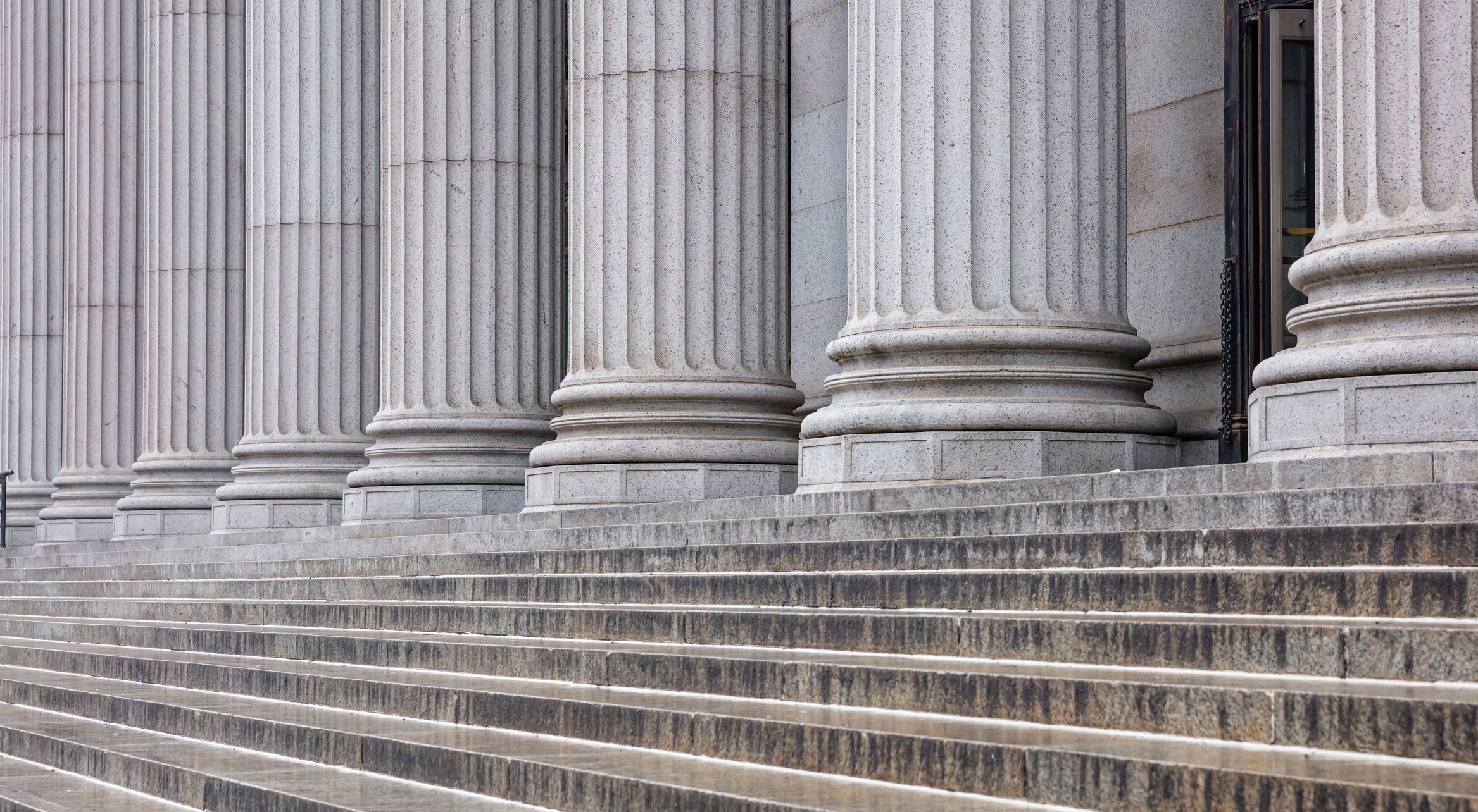 Stone pillars row and stairs detail. Classical building facade stock photo 1